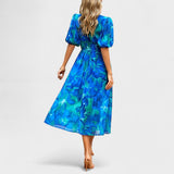 Jorė – Elegantiška gėlėta midi suknelė