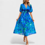 Jorė – Elegantiška gėlėta midi suknelė