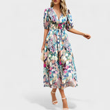 Jorė – Elegantiška gėlėta midi suknelė